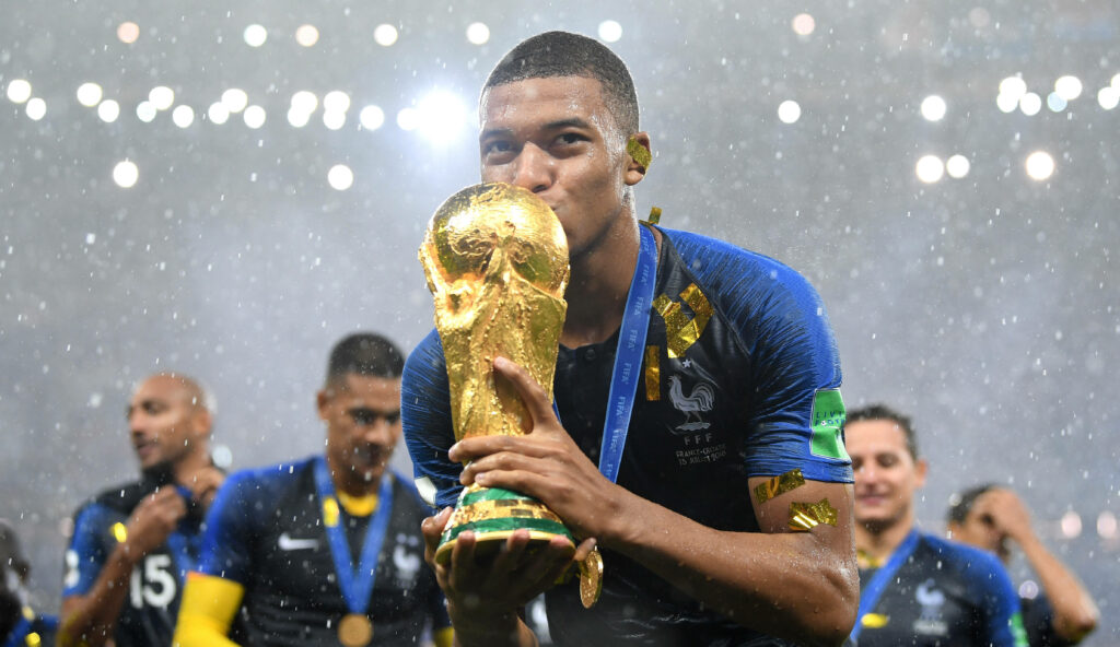 Kylian Mbappe Celebrates FIFA World Cup Victory - Stunning Wallpaper