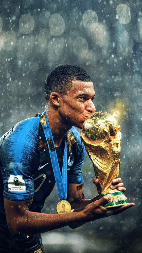 Kylian Mbappe Kissing FIFA World Cup Trophy - Iconic Football Wallpaper