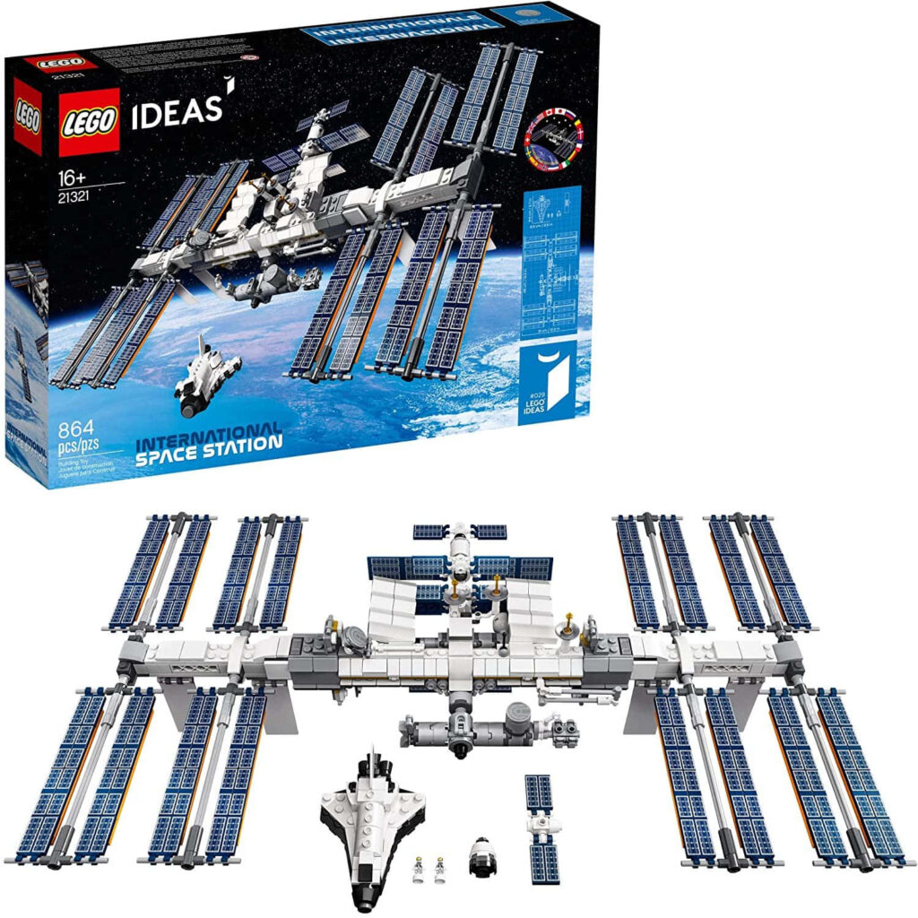 Detailed LEGO International Space Station model with solar panels and LEGO IDEAS box background Wallpaper