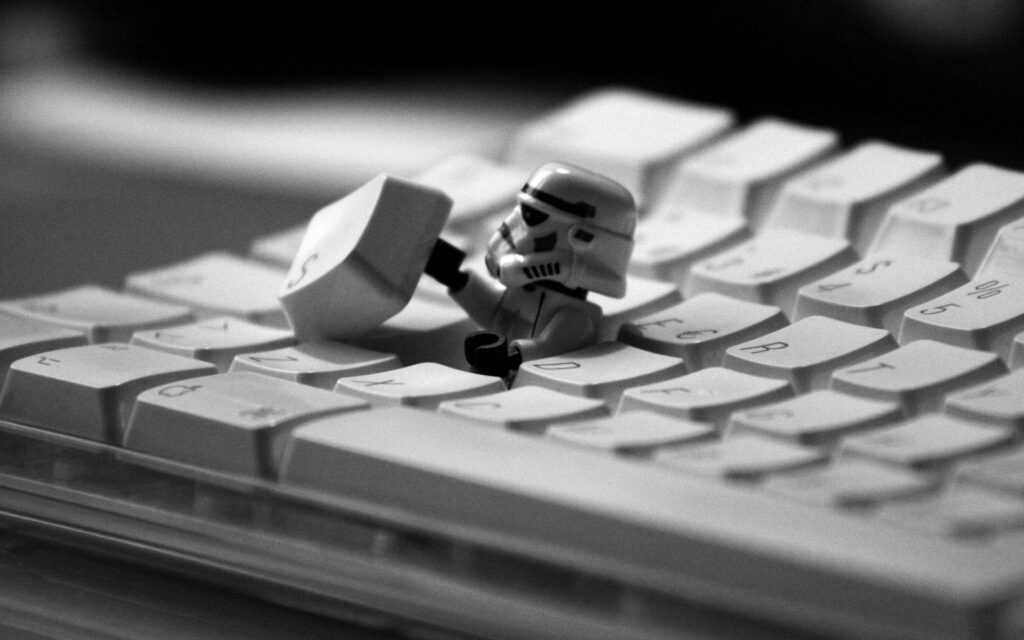 Fun LEGO Stormtrooper Wallpaper: Humorous Keyboard Interaction