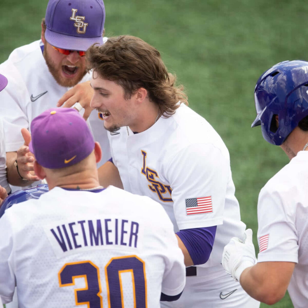 LSU Baseball Dylan Crews Trent Vietmeier celebrating victory energetic team spirit wallpaper