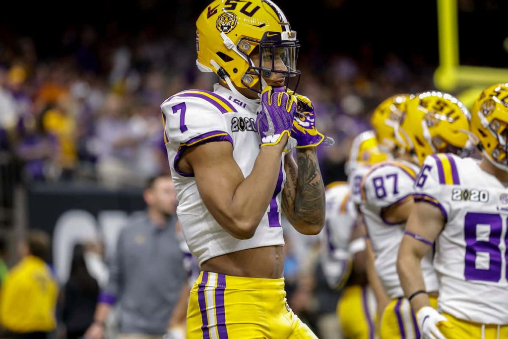 LSU football wallpaper featuring star safety Grant Delpit in stadium action wearing number 7 uniform