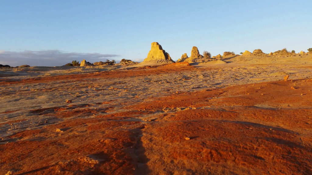 Lake Mungo Australian Outback landscape red earth eroded formations golden sunlight sky wallpaper