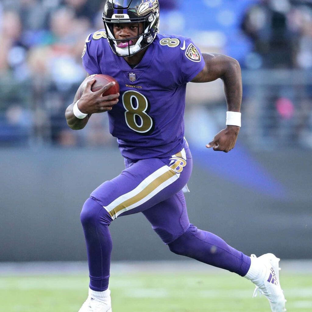 Lamar Jackson Baltimore Ravens quarterback in action dynamic football wallpaper background