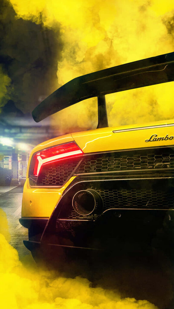 Lamborghini Aventador rear view with yellow smoke wallpaper showcasing sleek design power