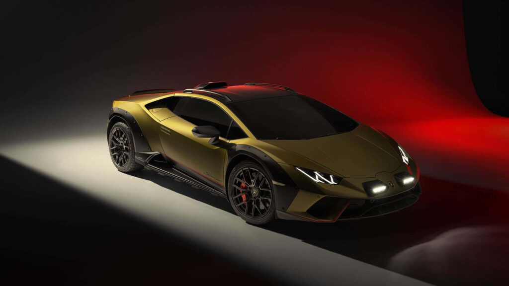 Lamborghini Huracan sports car under dramatic lighting showcasing sleek design and aggressive stance Wallpaper