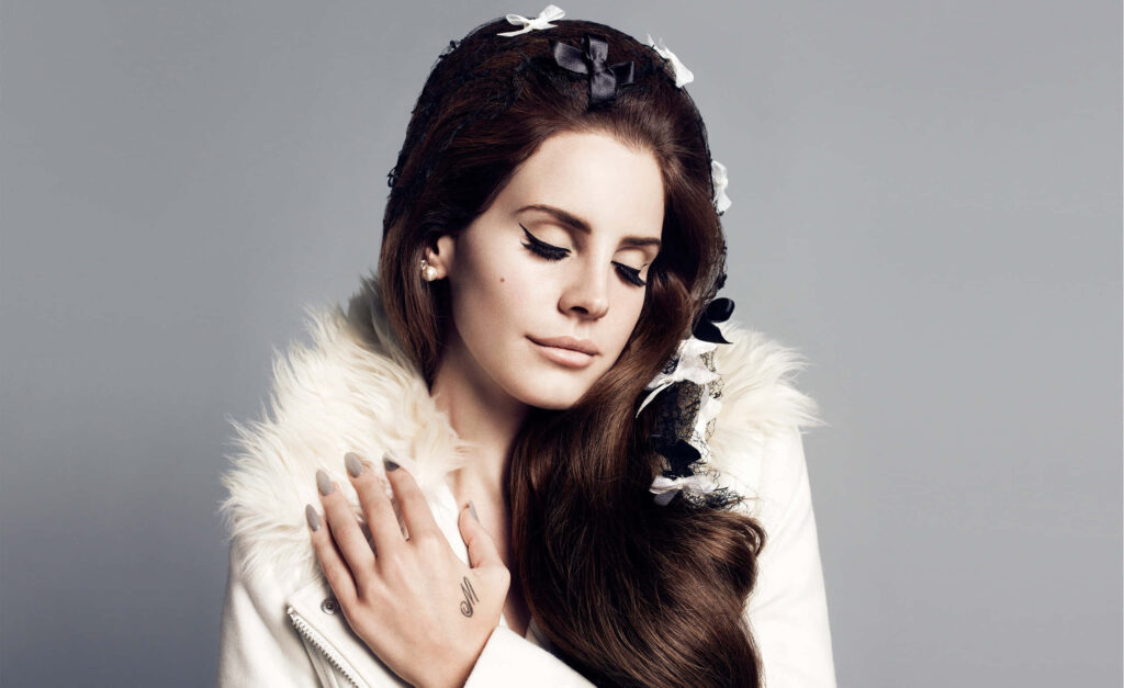 Lana Del Rey's Elegant Style: Serene Expression Wallpaper Background