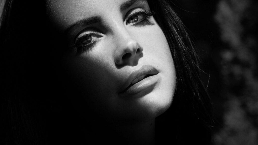 Melodious Muse: Captivating Lana Del Rey in QHD Wallpaper for a Mesmerizing Background