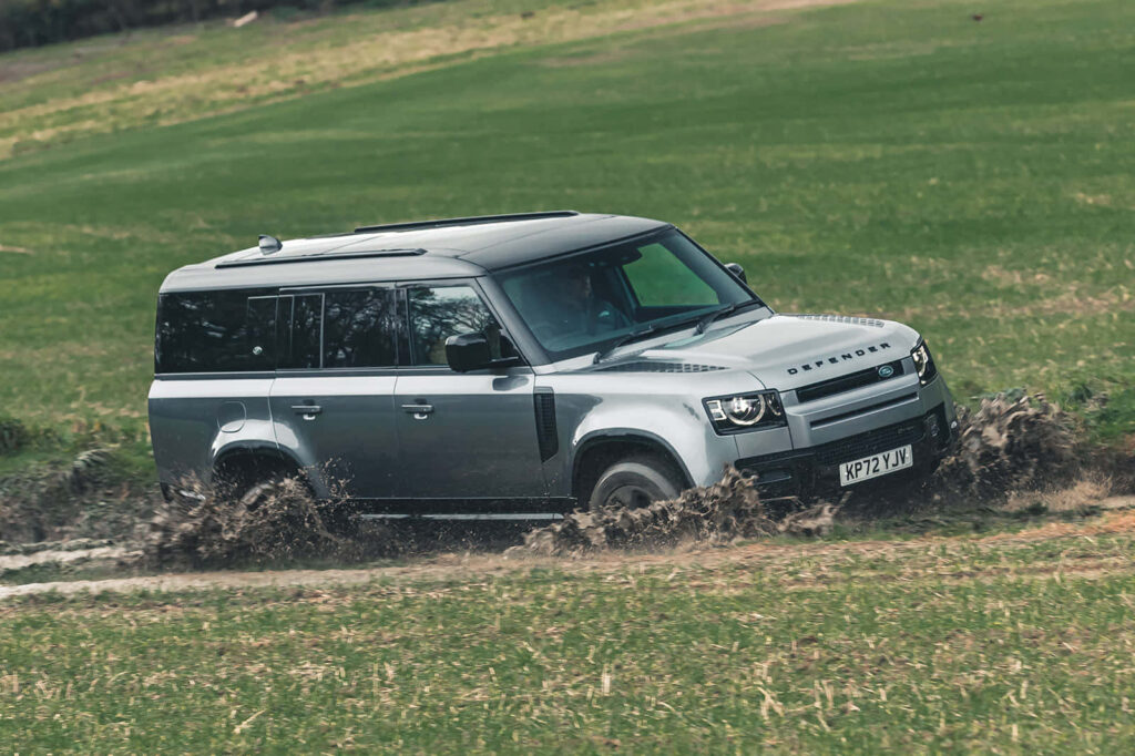 Sleek Land Rover Defender: Off-Road Adventure Wallpaper Background