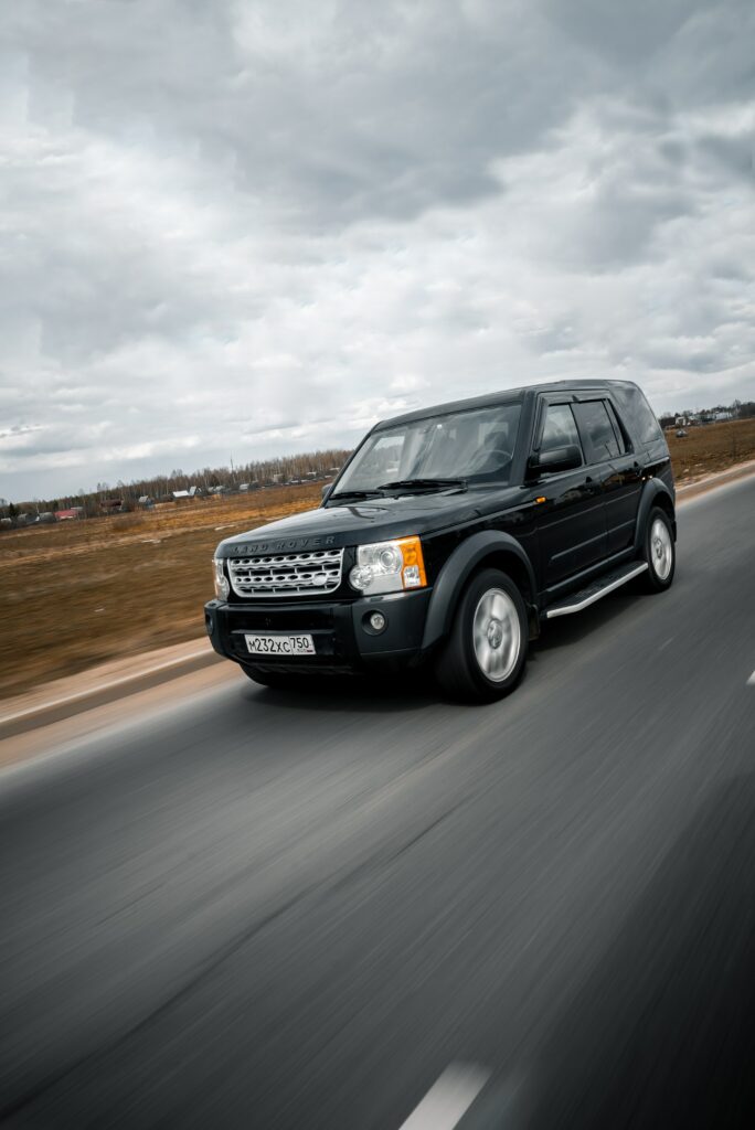Land Rover Discovery 3: Sleek SUV in Scenic Open Landscape Wallpaper