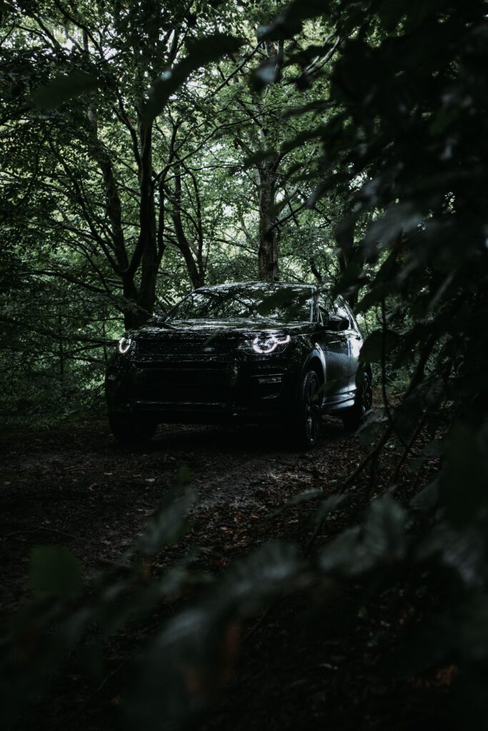 Land Rover SUV in Lush Greenery - Rugged Adventure Wallpaper