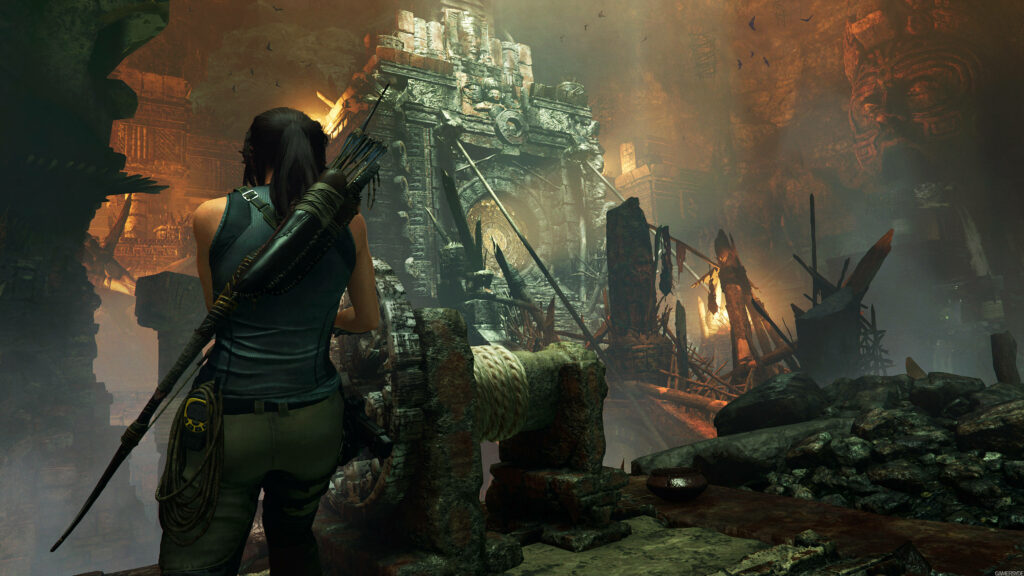 Lost Pathways: Lara Croft Contemplates the Decayed Portal in Shadow of the Tomb Raider Wallpaper