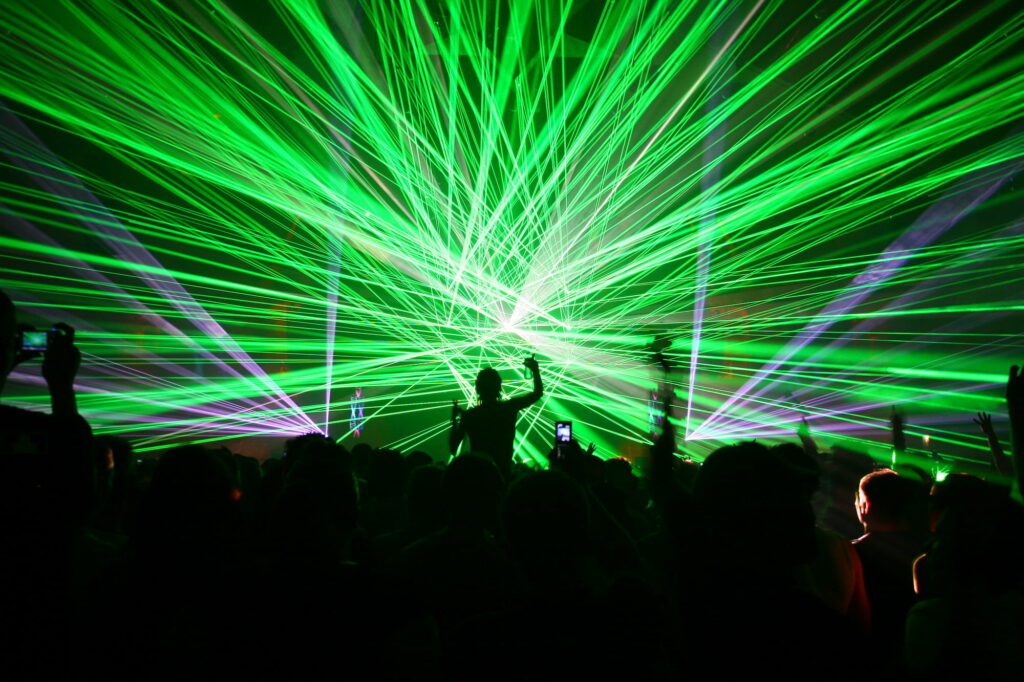 Euphoric Laser Show Igniting a Rave Party in High-Definition Wallpaper