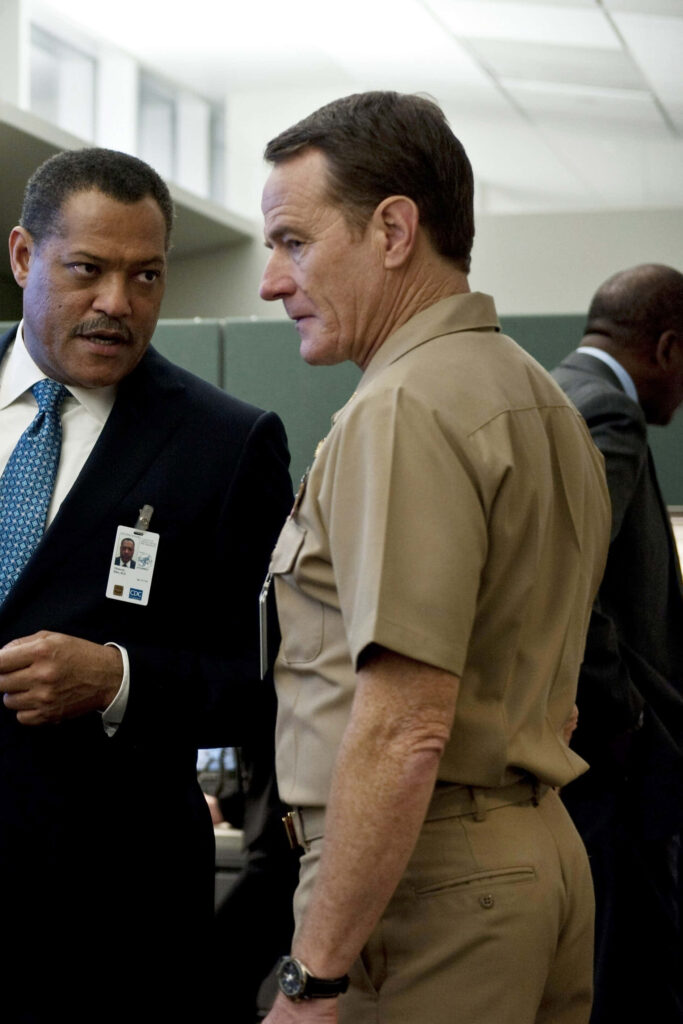 Laurence Fishburne and Bryan Cranston tense office scene from Contagion 2011 pandemic thriller Wallpaper