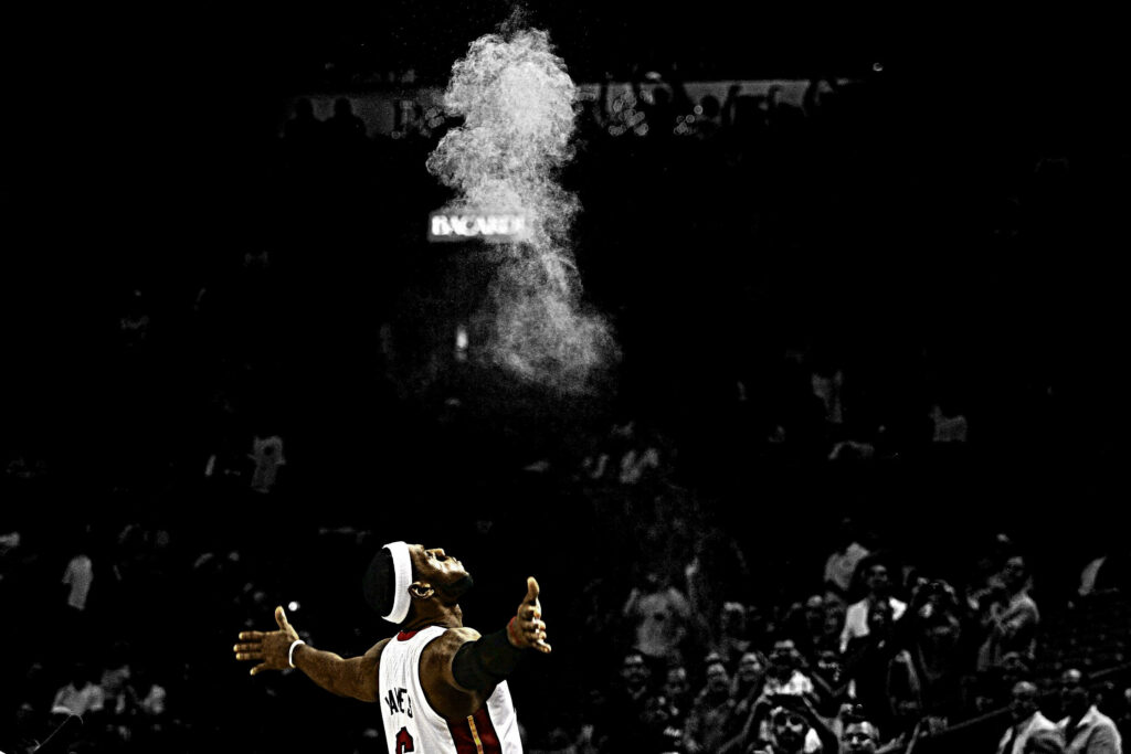 LeBron James' Iconic Chalk Toss: Dynamic NBA Wallpaper Background