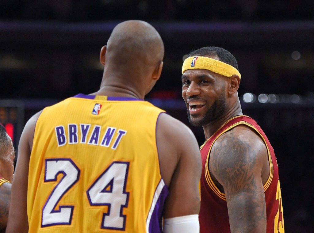 LeBron & Kobe Candid Game Moment Wallpaper - Iconic NBA Background