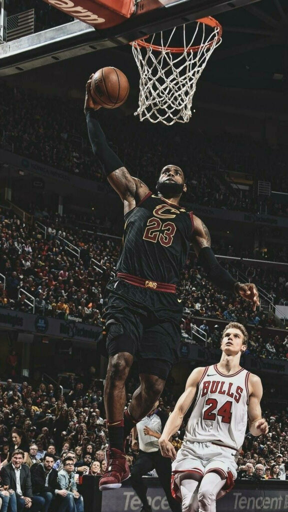 LeBron James Mid-Air Slam Dunk Wallpaper - Dominant Basketball Art