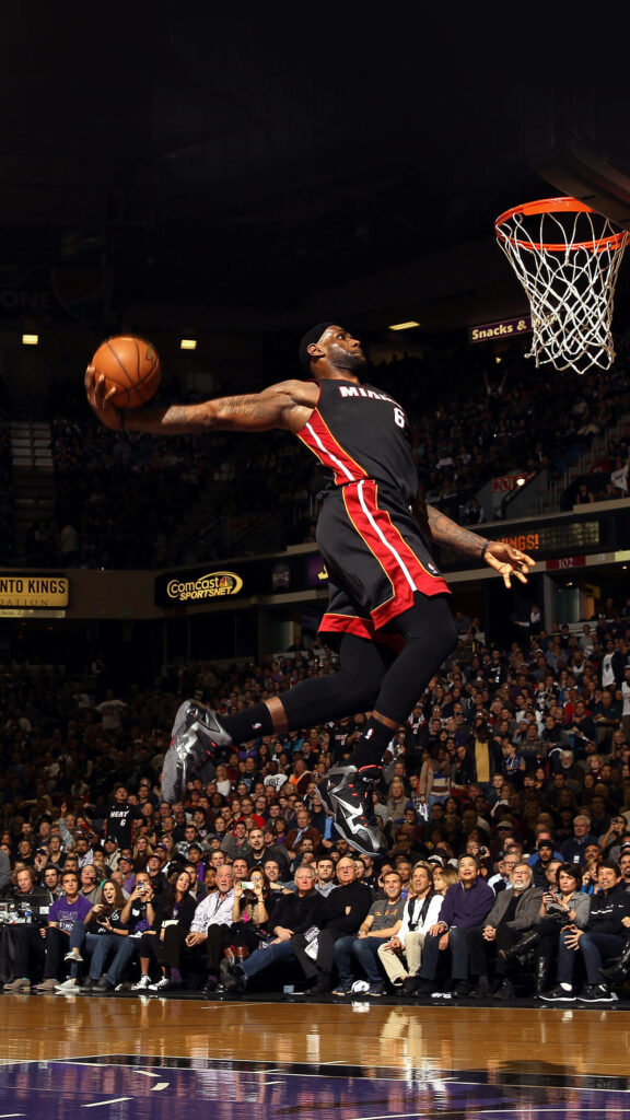 LeBron James' Powerful Dunk: Epic Sports Wallpaper Background