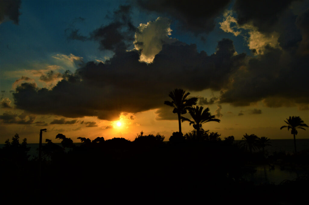 Captivating Twilight Over Lebanon: Radiant Sunset Illuminating Dusky Clouds Amidst Azure Skies Wallpaper