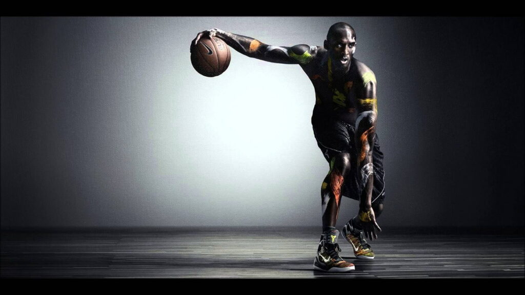 Kobe Bryant dribbling in spotlight with artistic body paint high-definition sports wallpaper background