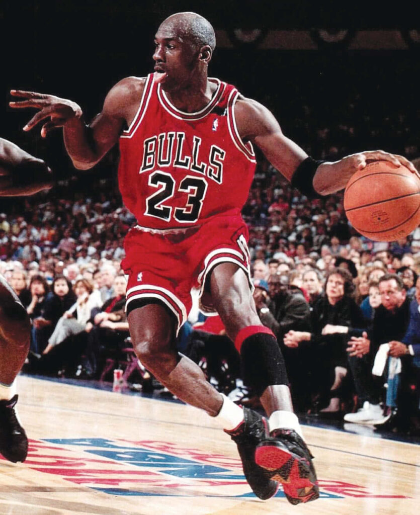 The Undisputed Basketball Legend: Michael Jordan Dominating the NBA with 6 Championships and 5 MVP Titles! Wallpaper