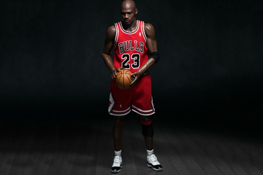 Legendary Michael Jordan Captured in Iconic Studio Pose with Basketball Wallpaper
