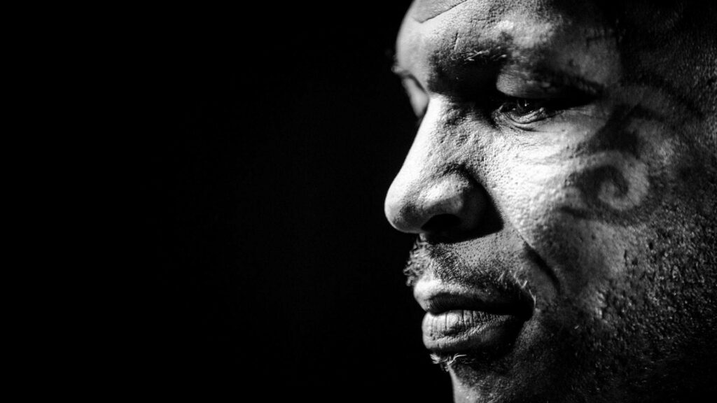 The Enigmatic Profile: Mighty Mike Tyson Captured in Timeless Monochrome Wallpaper