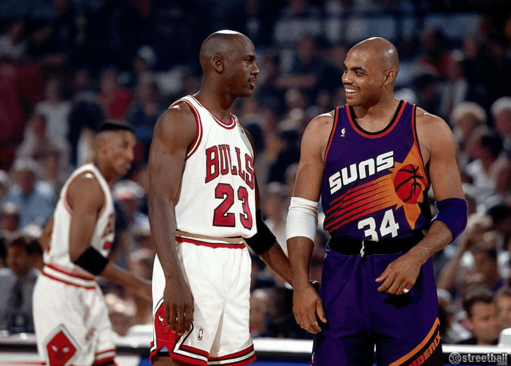 Distinguished NBA Legends Barkley and Jordan Embrace in Candid Snapshot at NBA League Wallpaper