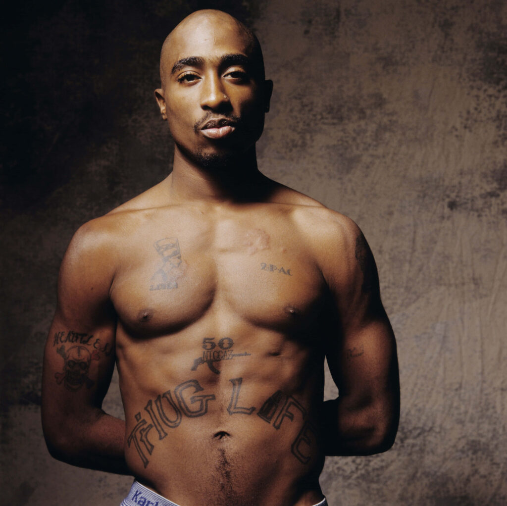 The Immortal Tupac Shakur: A Stage Masterpiece Celebrating Hip Hop's Luminary and 'Keep Ya Head Up' Wallpaper