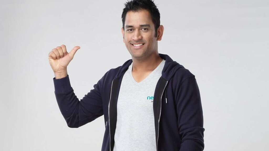 Captain Cool Dhoni Posing Strikingly in White and Blue Overcoat – High-Resolution Wallpaper