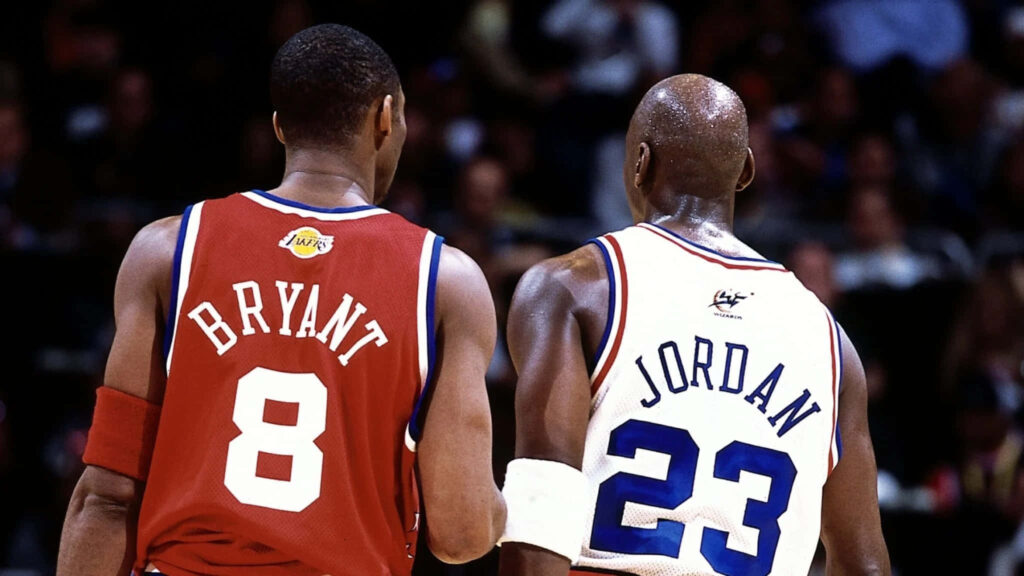 Legends Collide: The Gaze Between Michael Jordan and Kobe Bryant - A Captivating Snapshot of Basketball Greatness Wallpaper