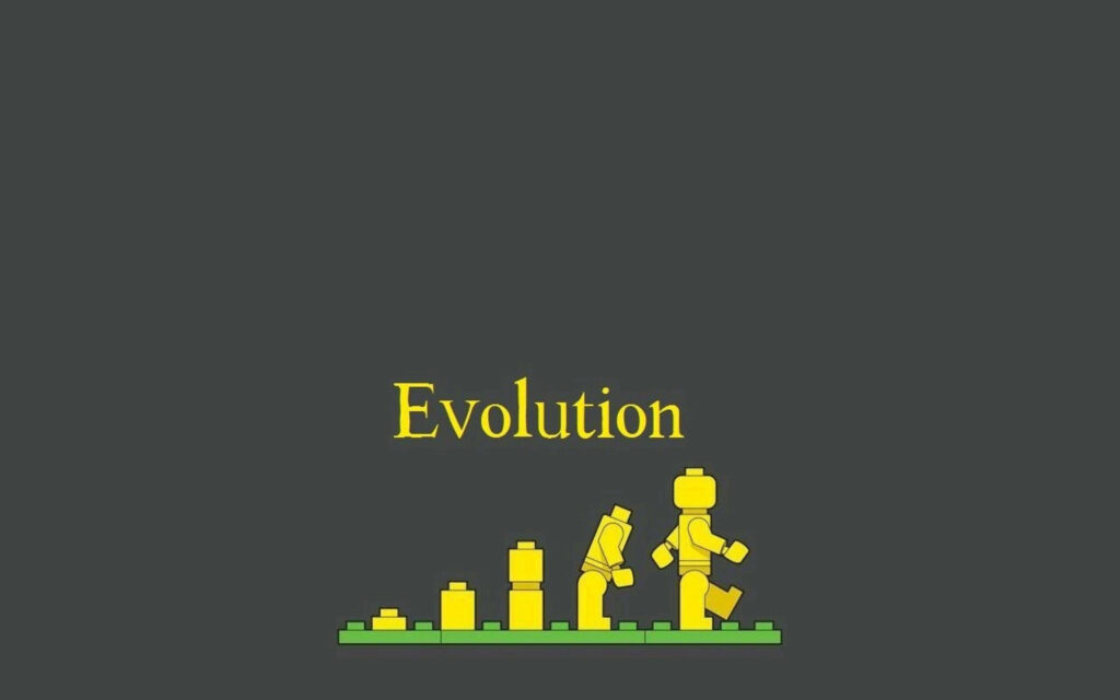 Lego mini-figures evolution wallpaper showing progression from blocks to complete figure dark background