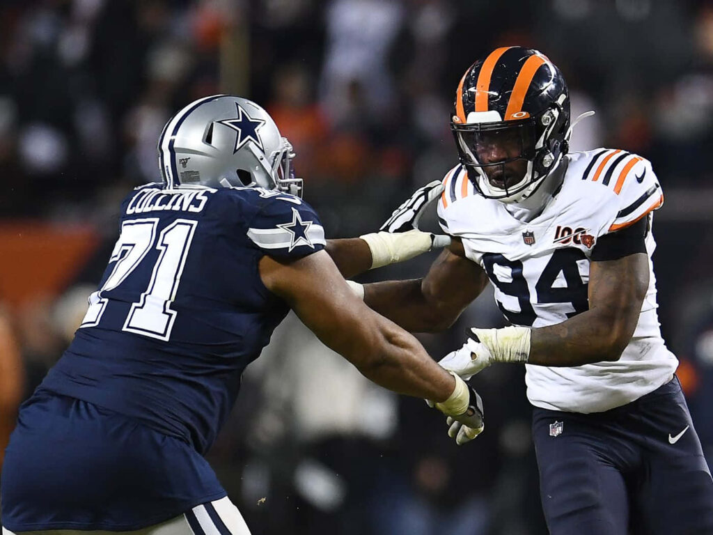 Leonard Floyd tackles Lael Collins in intense Chicago Bears vs Dallas Cowboys NFL game action wallpaper