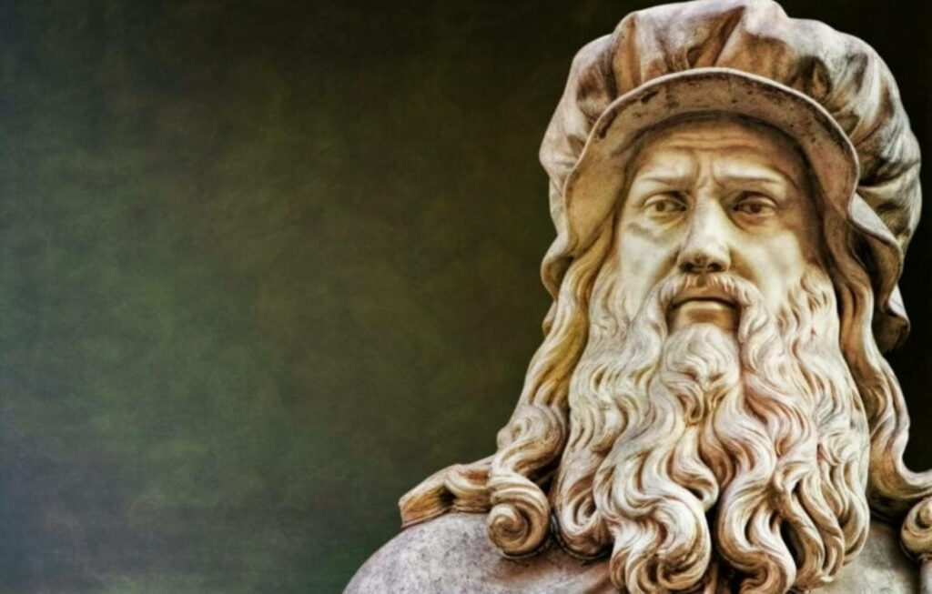 Close-up of Leonardo Da Vinci statue in Florence showcasing detailed Renaissance craftsmanship wallpaper