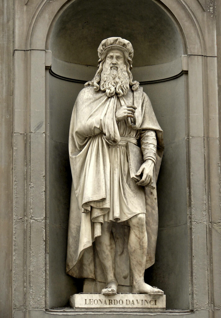 Leonardo Da Vinci statue in Florence stone niche detailed Renaissance sculpture wallpaper background