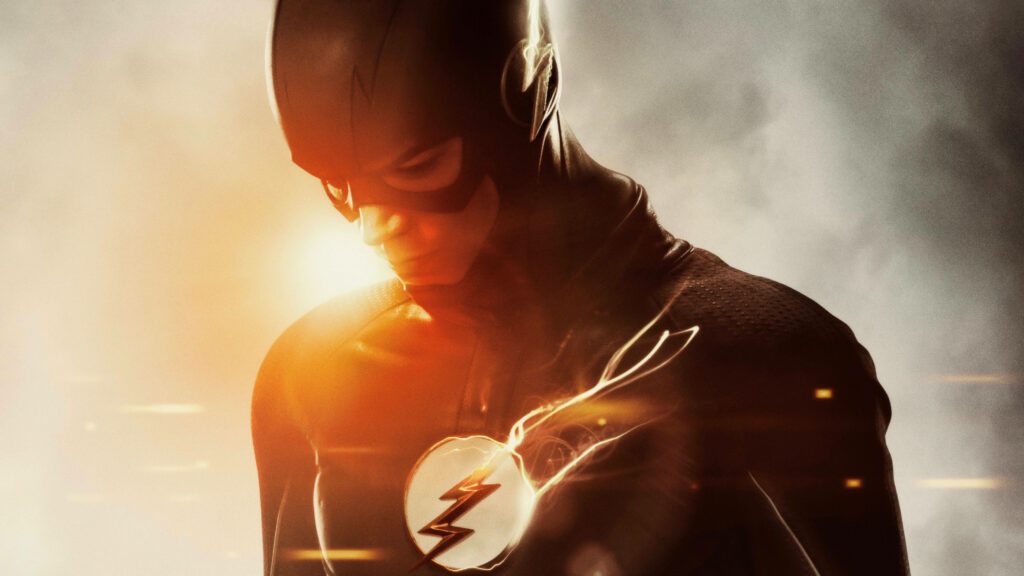 The Flash Costume with Lightning Bolt Emblem - Barry Allen Super-Speedster Backlit by Burst of Light Wallpaper