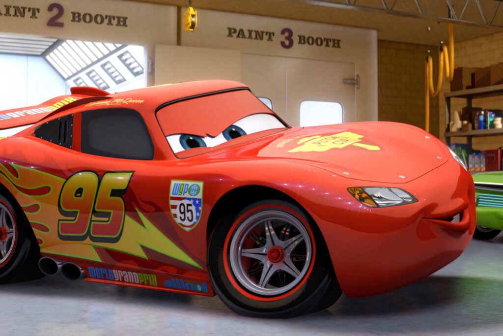 Lightning McQueen Cars 3 red race car number 95 with lightning decals in vibrant garage background Wallpaper