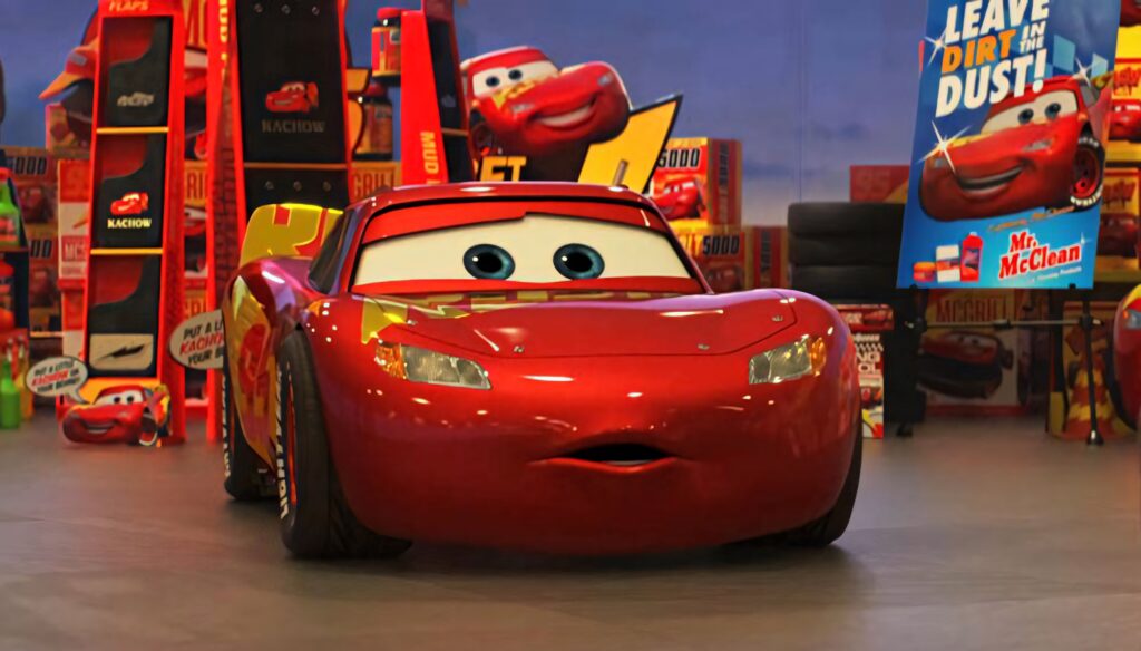 Lightning McQueen vibrant Cars 3 wallpaper red yellow garage animated Pixar character background