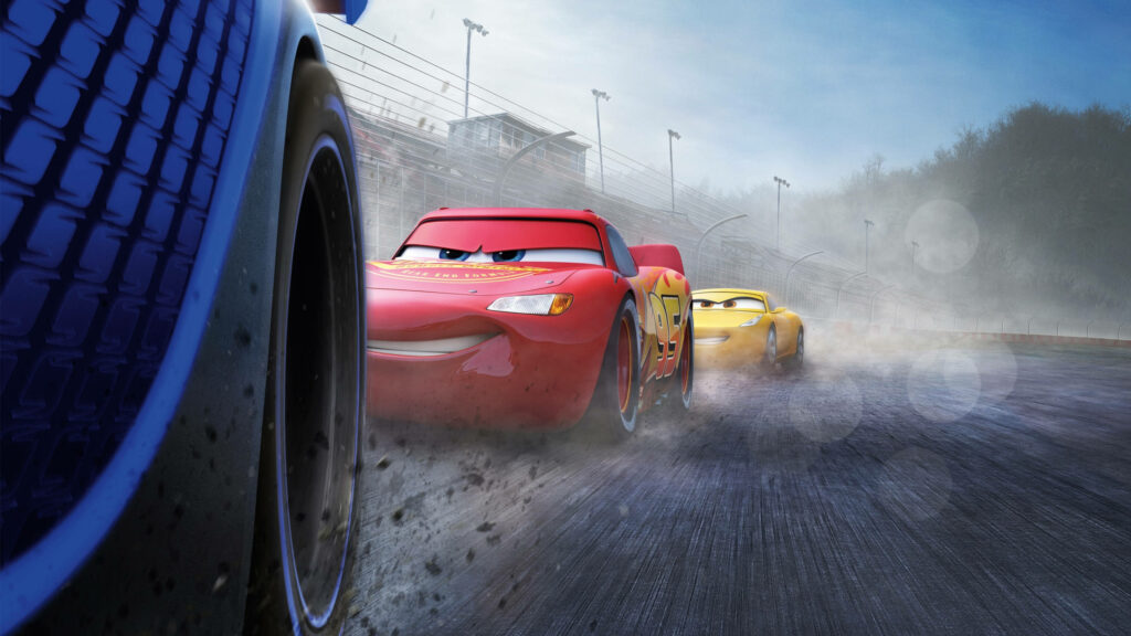 Lightning McQueen Cruz Ramirez race Jackson Storm on misty track with vibrant colors motion blur Wallpaper