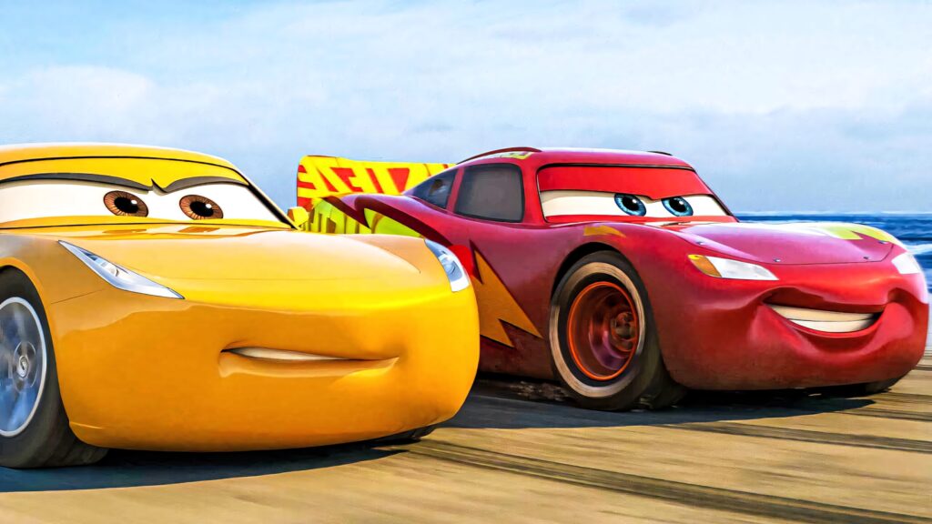 Lightning McQueen and Cruz Ramirez race on sunlit sandy beach vibrant Cars 3 animated wallpaper background