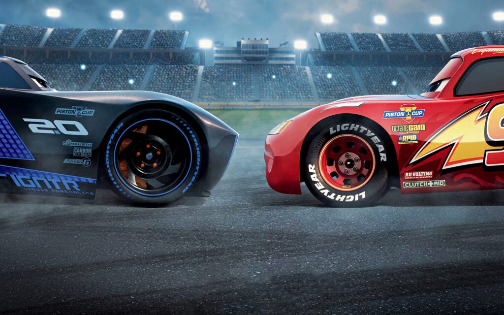 Lightning McQueen and Jackson Storm intense rivalry vivid red blue colors dynamic stadium wallpaper