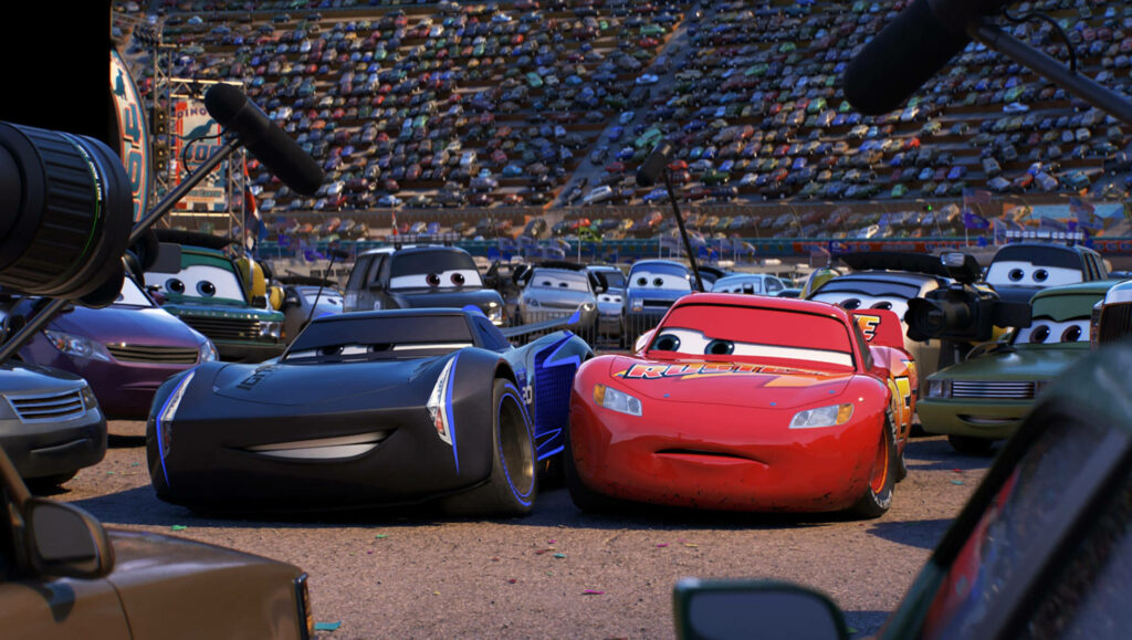 Lightning McQueen and Jackson Storm face off in crowded stadium during intense Cars 3 interview Wallpaper