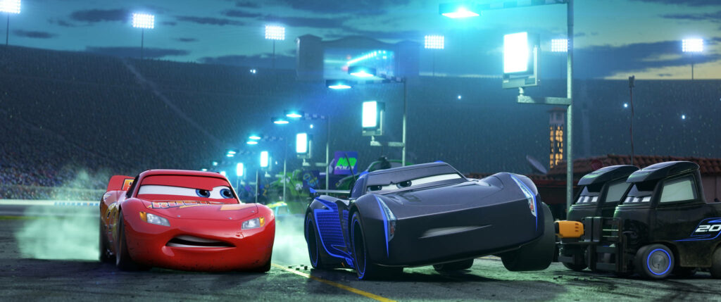 Lightning McQueen and Jackson Storm racing fiercely on vibrant Cars 3 racetrack wallpaper background