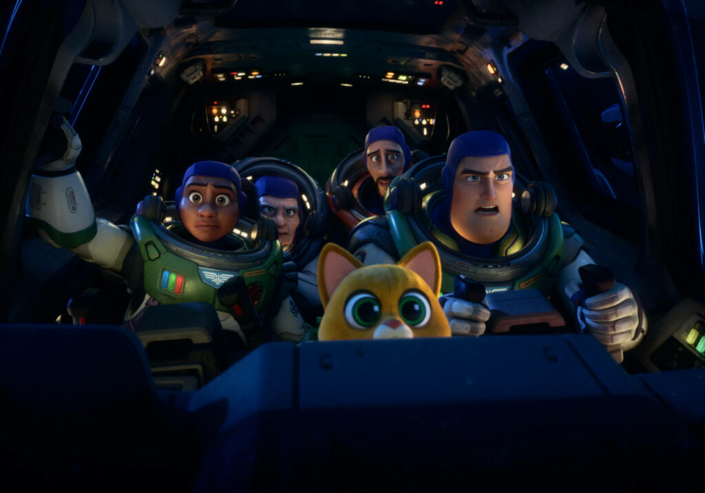 Lightyear and astronauts in spaceship cockpit with determined expressions on space adventure wallpaper