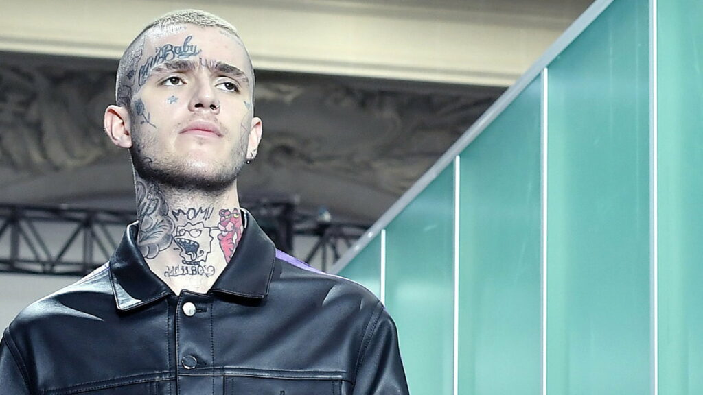 Lil Peep portrait in black jacket with face and neck tattoos runway fashion HD wallpaper background