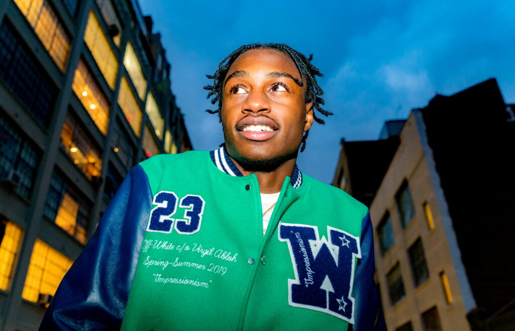 Melodic Harmony: Lil Tjay Takes Center Stage in Stunning HD Wallpaper