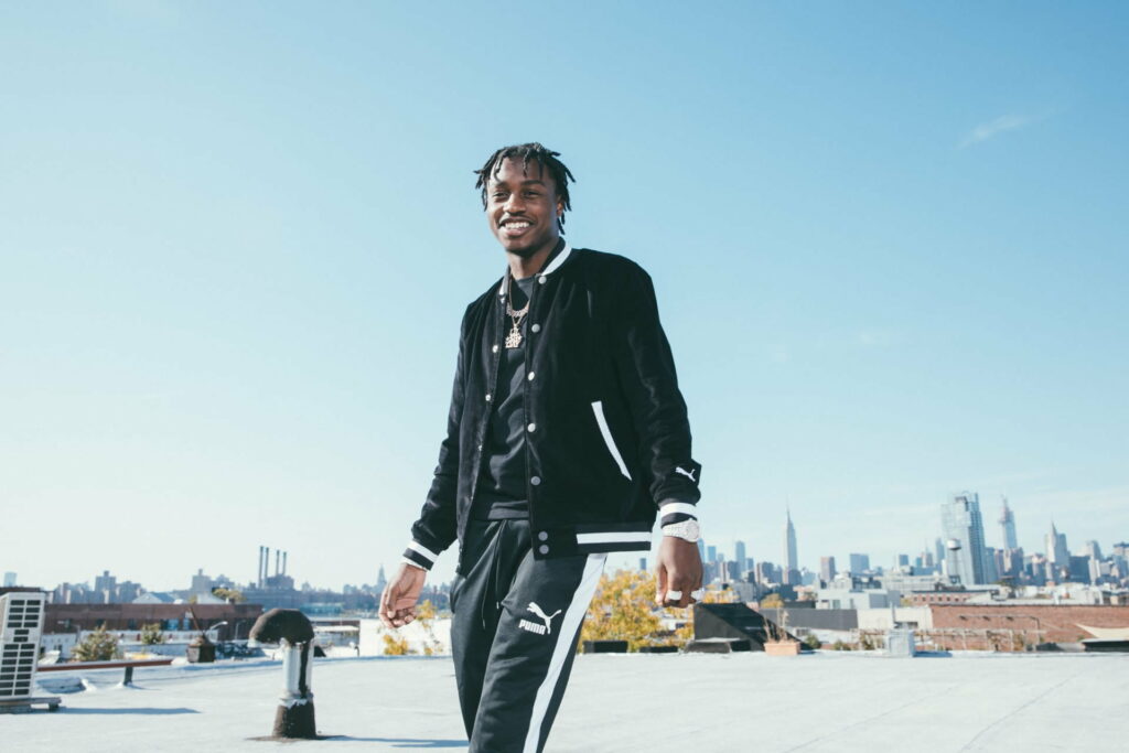 Lil Tjay: Melodic Rhythms in Vibrant HD - A Captivating Rapper Wallpaper