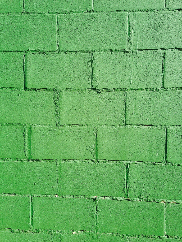 Vibrant Lime Green Brick Wall Texture – Bold Wallpaper Background