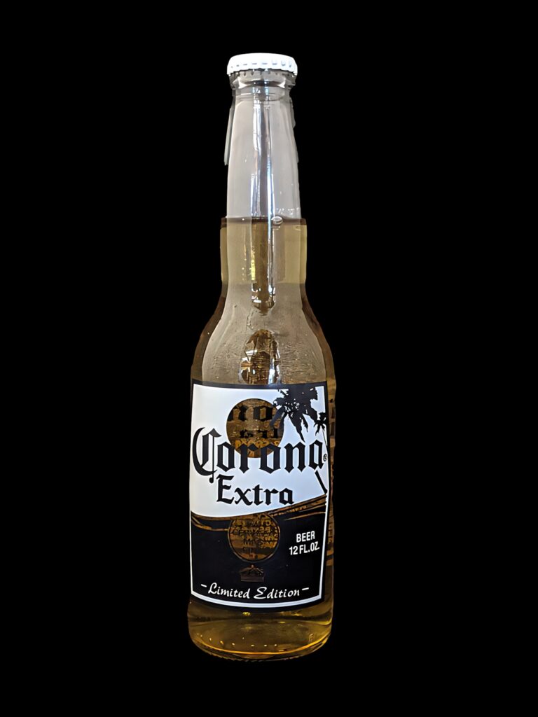 Corona Beer Limited Edition clear bottle on black background highlighting golden hues and label Wallpaper