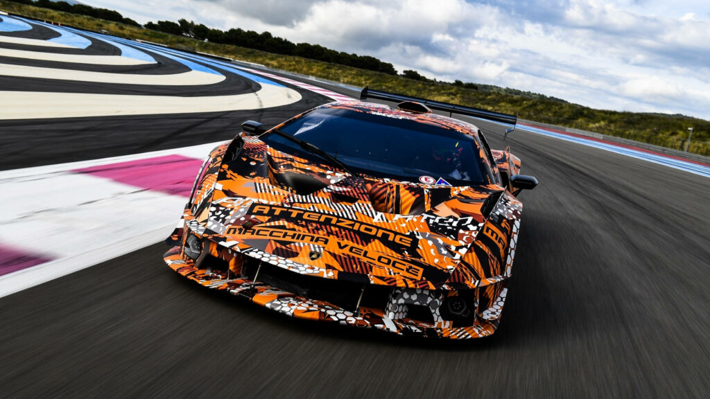 Limited Edition Lamborghini Essenza SCV12 racing on track with vibrant camouflage livery wallpaper